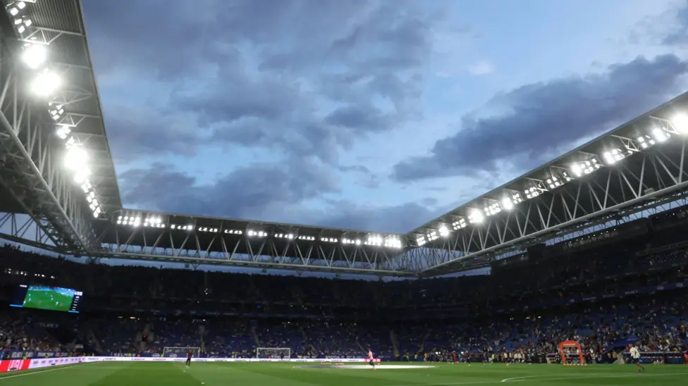 13 injured as car crashes into crowd at Espanyol-Barcelona match.